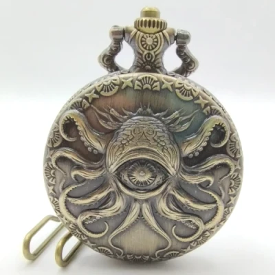 Metal pocket dice case with polyhedral mini-kit: extra-dimensional horror - gold in a black suedecloth pouch