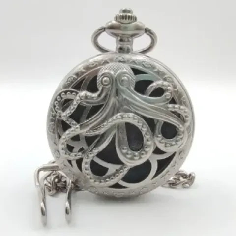 Metal pocket dice case with polyhedral mini-kit: hollow silver kraken in a black suedecloth pouch