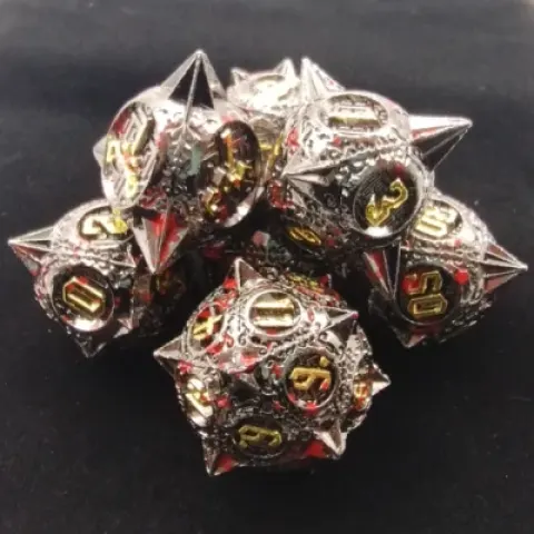 Spiky metal dice: bloodied black with gold numbers in a black suedecloth bag