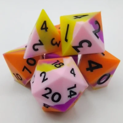 Silicone dice - pink, purple, orange, and yellow with black numbers