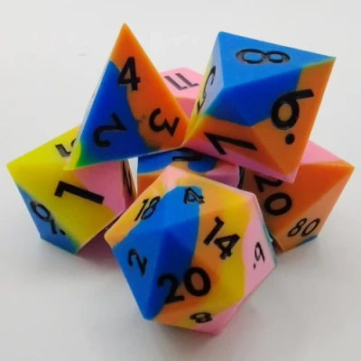 Silicone dice - blue, orange, pink, and yellow with black numbers