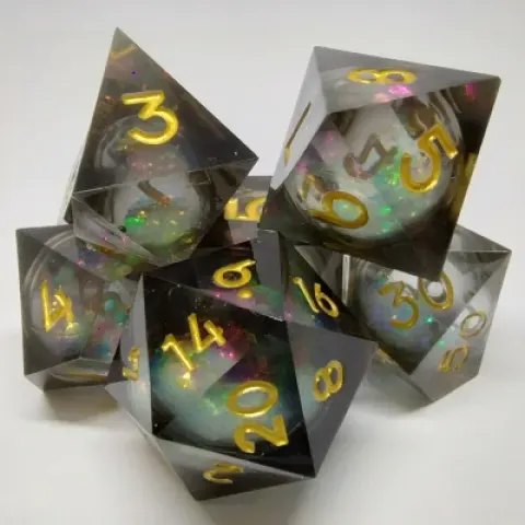 Maelstrom of Dreams dice kit - black and gold in a bottle with screw-cap