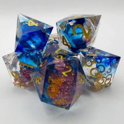 Mystic Effervescence - blue-stained translucence with gold foil and pink sparkles in a bottle with screw-cap