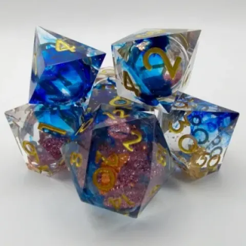 Mystic Effervescence - blue-stained translucence with gold foil and pink sparkles in a bottle with screw-cap